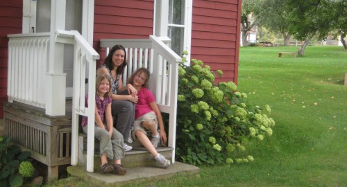 The author and her kids on the front stoop of the Almanzo Wilder Homestead, September 2010